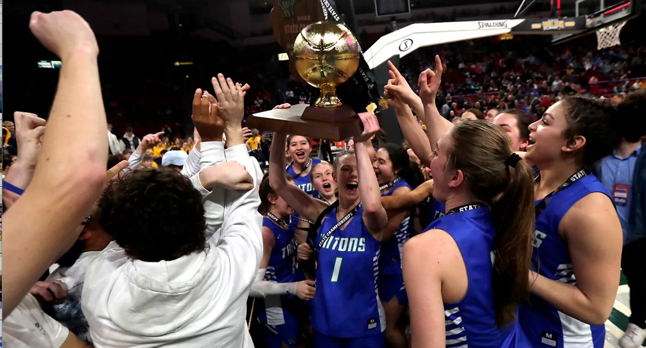 Green Bay Notre Dame players celebrate with fans after winning the WIAA Division 2 girls basketball championship against Pewaukee High School on March 11, 2023, at the Resch Center. (Sarah Kloepping/USA TODAY NETWORK-Wisconsin)