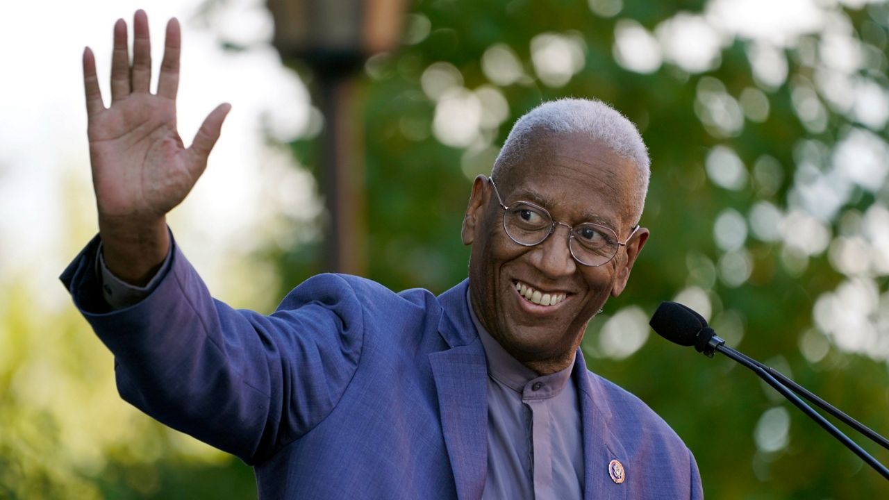 U.S. Rep. Donald McEachin waves during a rally for Democratic gubernatorial candidate Terry McAuliffe in Richmond, Va., on Oct. 23, 2021. (AP Photo/Steve Helber, File)