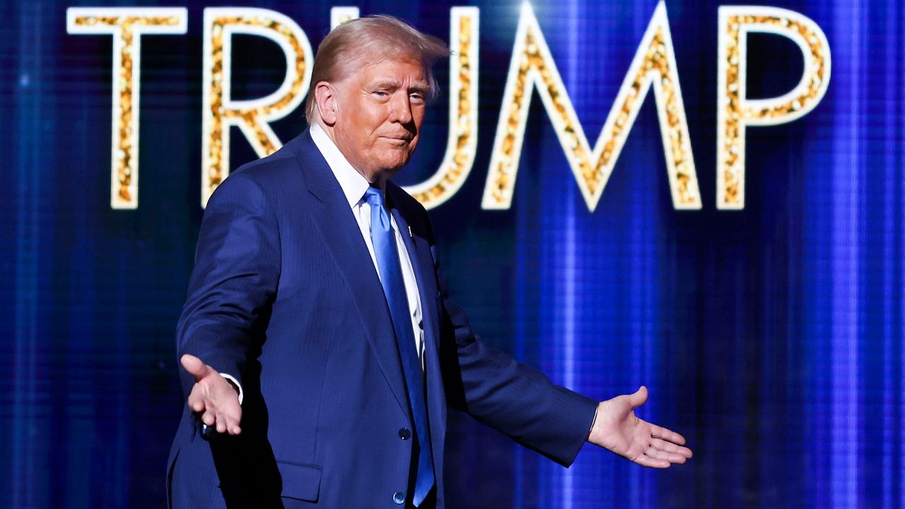 President-elect Donald Trump takes the stage before he speaks at the FOX Nation Patriot Awards, Thursday, Dec. 5, 2024, in Greenvale, N.Y. (AP Photo/Heather Khalifa)