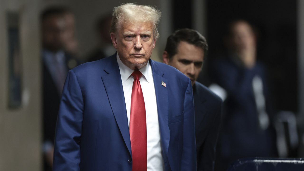 Former President Donald Trump walks to speak to reporters at Manhattan criminal court, Monday, May 6, 2024 in New York. (Win McNamee/Pool Photo via AP, File)