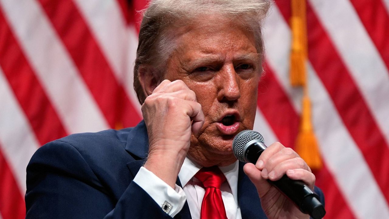 Republican presidential nominee and former President Donald Trump speaks with Tucker Carlson at Desert Diamond Arena, Thursday, Oct. 31, 2024, in Glendale, Ariz. (AP Photo/Julia Demaree Nikhinson)