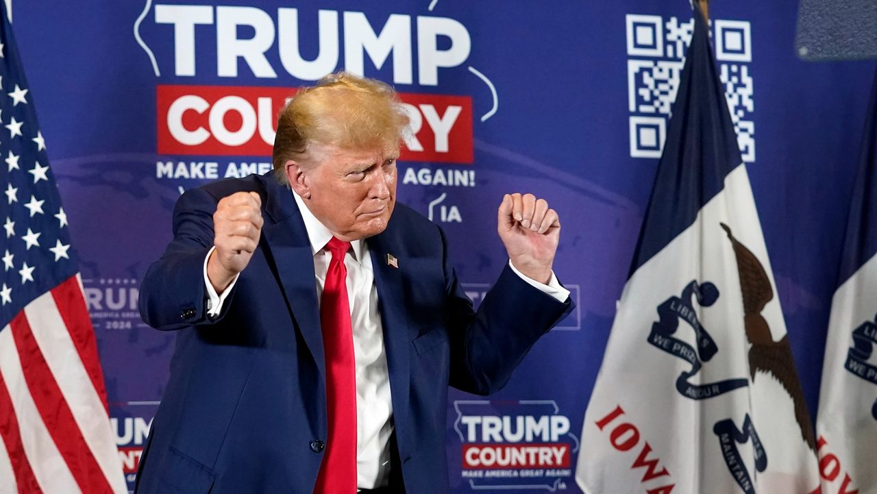 Former President Donald Trump dances after speaking at a campaign rally in Iowa on Friday, Jan. 5, 2024.