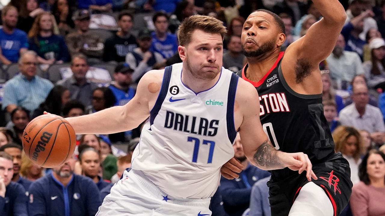 Dallas Mavericks guard Luka Doncic (77) drives against Houston Rockets guard Eric Gordon (10) during the first quarter of an NBA basketball game in Dallas, Thursday, Dec. 29, 2022. (AP Photo/LM Otero)