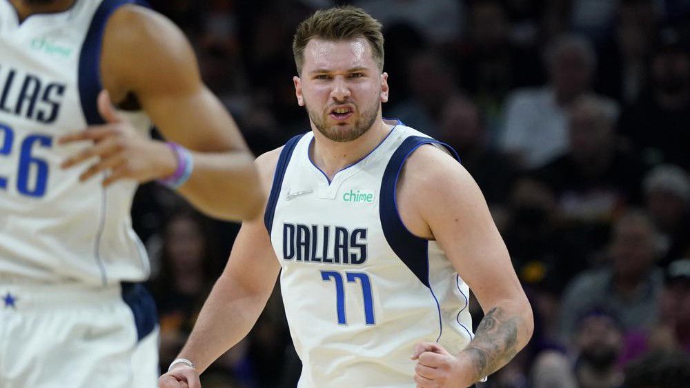 Dallas Mavericks guard Luka Doncic (77) celebrates a basket against the Phoenix Suns during the first half of Game 7 of an NBA basketball Western Conference playoff semifinal, Sunday, May 15, 2022, in Phoenix. (AP Photo/Matt York)