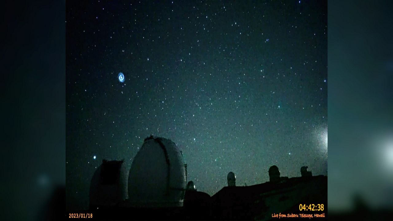 This image taken from video provided by the NAOJ & Asahi Shimbun, shows spiral swirling through the night sky from Mauna Kea, Hawaii's tallest mountain. Researchers believe it shows the after effects of a SpaceX rocket launch when the company's Falcon 9 rocket sent a GPS satellite into orbit. The images were captured on Jan. 18, 2023, by a camera at the summit of Mauna Kea outside the National Astronomical Observatory of Japan's Subaru telescope. (NAOJ & Asahi Shimbun via AP)