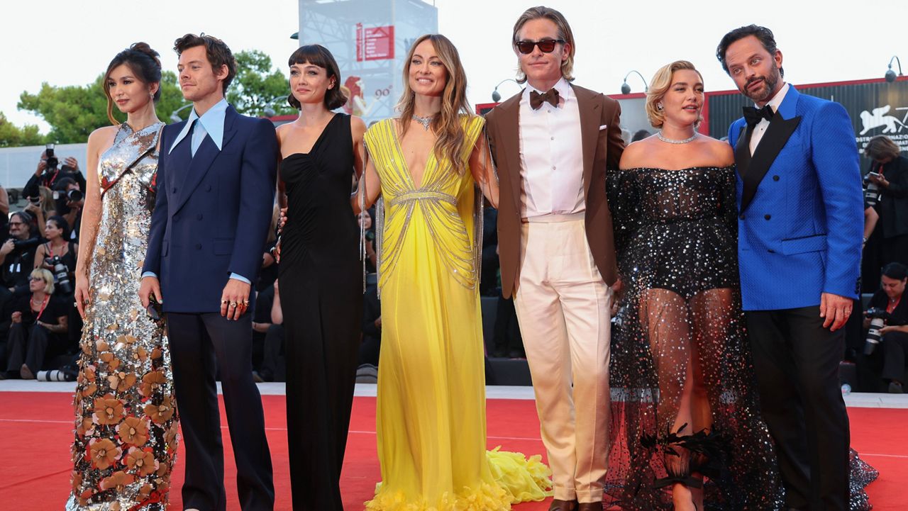 Gemma Chan, from left, Harry Styles, Sydney Chandler, director Olivia Wilde, Chris Pine, Florence Pugh and Nick Kroll pose for photographers upon arrival at the premiere of the film 'Don't Worry Darling' during the 79th edition of the Venice Film Festival in Venice, Italy, Monday, Sept. 5, 2022. (Photo by Vianney Le Caer/Invision/AP)