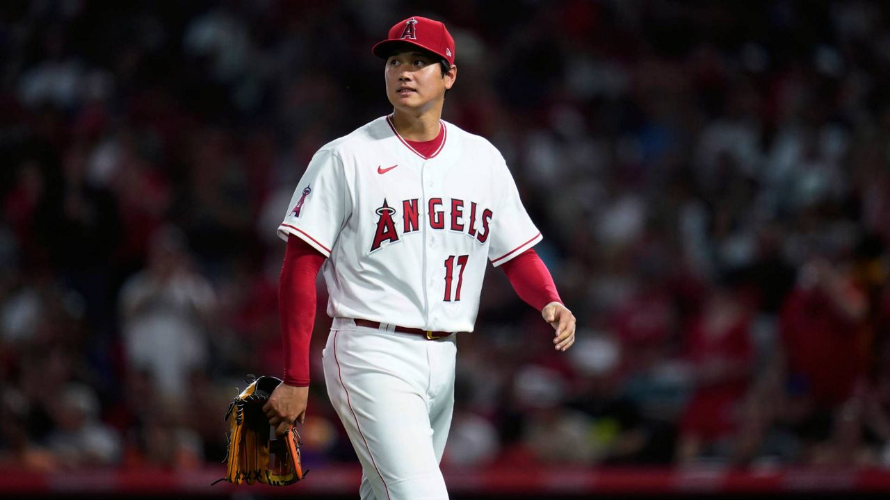 Los Angeles Angels starting pitcher Shohei Ohtani walks off the mound as he is replaced during the fifth inning of the team's baseball game against the Houston Astros on Thursday, April 7, 2022, in Anaheim, Calif. (AP Photo/Ashley Landis)