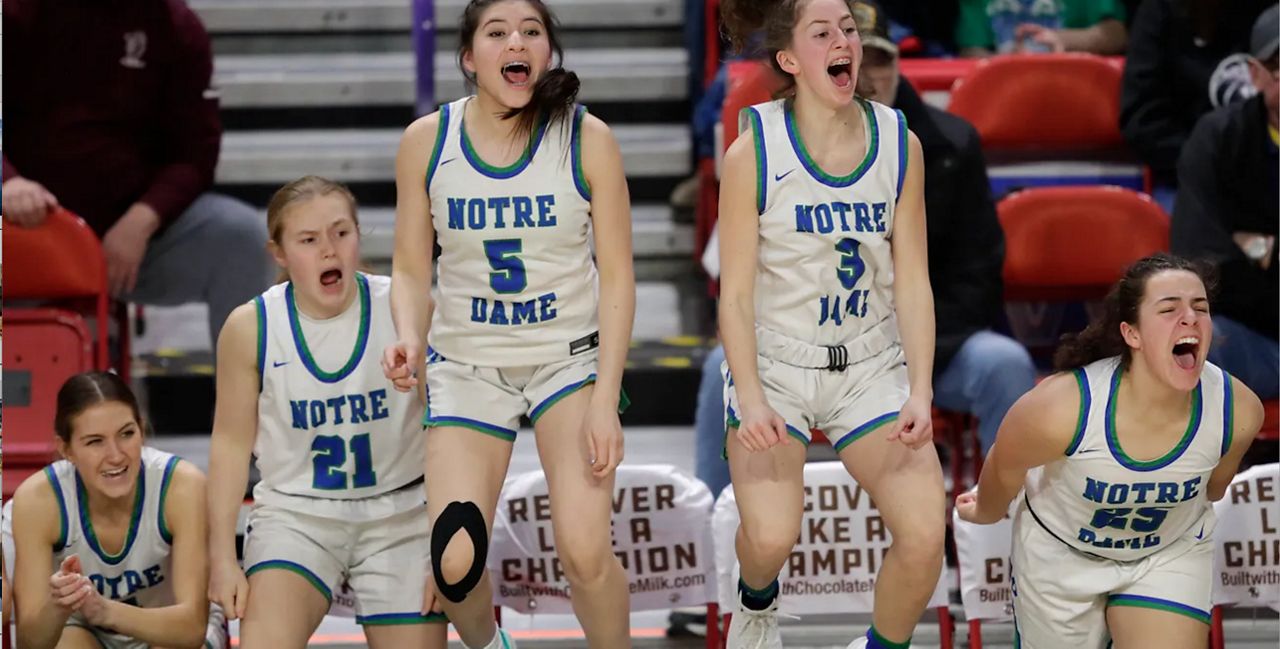 Green Bay Notre Dame Academy's players celebrate late in the game against McFarland High School during their WIAA Division 2 girls basketball semifinal game Friday, March 10, 2023, at the Resch Center in Ashwaubenon, Wis. Dan Powers/USA TODAY NETWORK-Wisconsin.