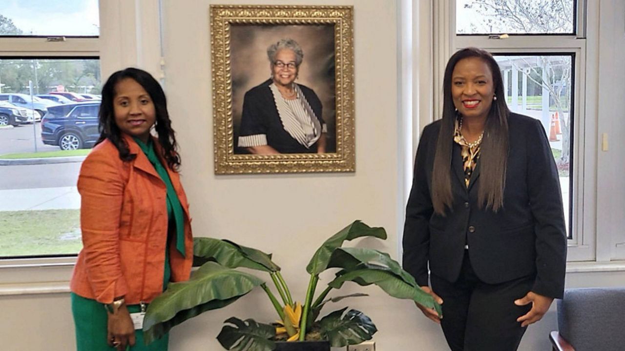 Doris Ross Reddick's cousin, Alva Simmons (left), and Reddick's daughter, Clemmie Perry, recently honored their relative's contributions to Hillsborough County. (Spectrum News/Saundra Weathers)