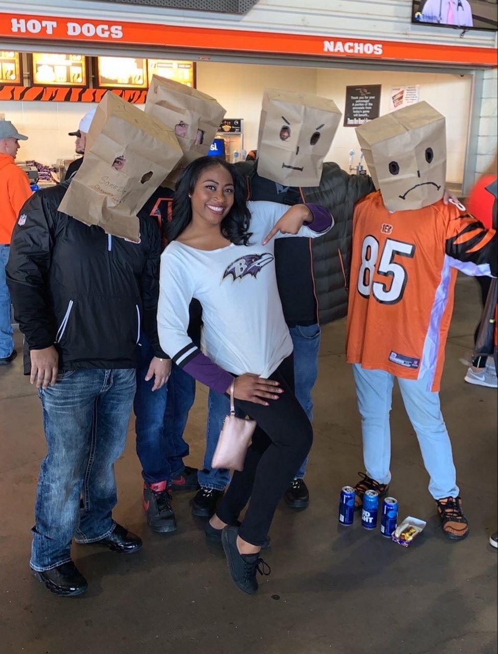 A Ravens fan, Kamara Douglas, poses with guests at Paul Brown Stadium in downtown Cincinnati during a Ravens-Bengals game. (Provided)