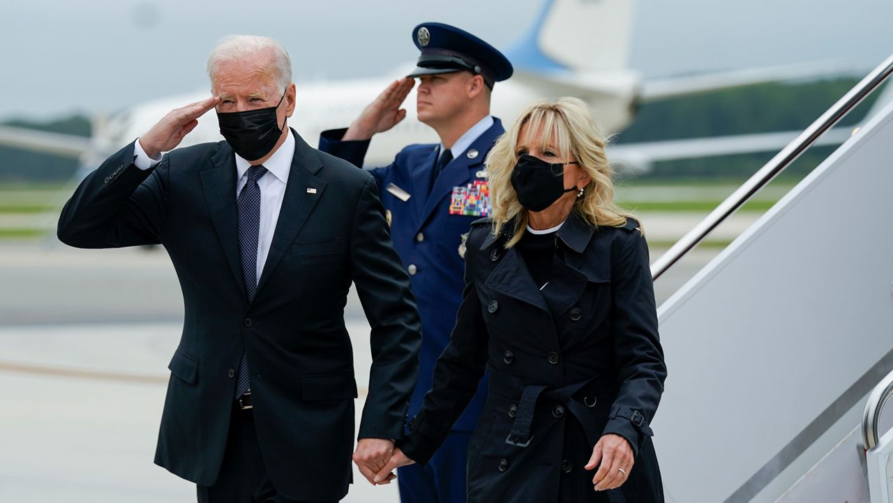 President Joe Biden returns a salute as he and first lady Jill Biden arrive at Dover Air Force Base. (AP Photo/Manuel Balce Ceneta)