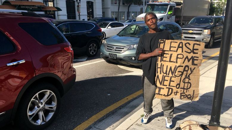 Panhandlers are expressing caution with the 'Downtown Ambassador Program.' (Erin Murray, staff)