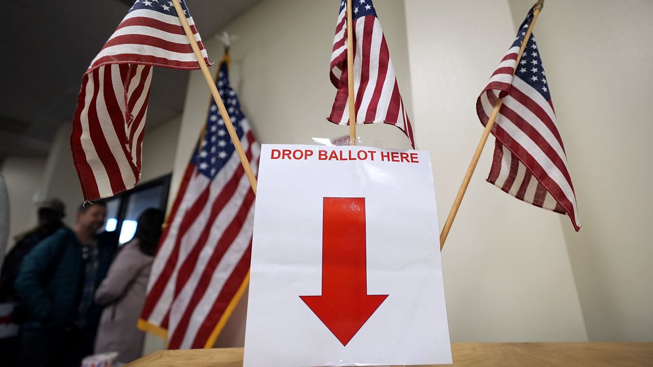 Early voting (AP Photo/Charlie Neibergall)