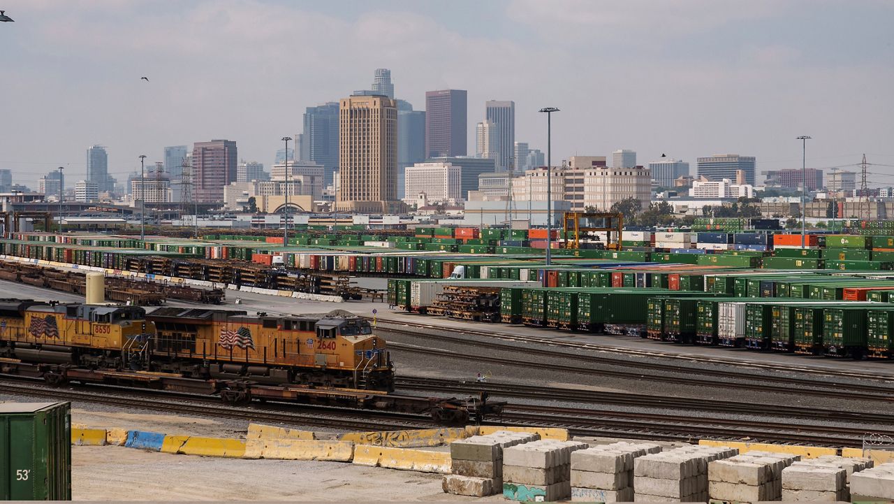 Los Angeles skyline is seen above the Union Pacific LATC Intermodal Terminal on April 25, 2023 in Los Angeles. (AP Photo/Damian Dovarganes)