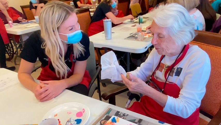 Ohio State students work with memory support residents to create art