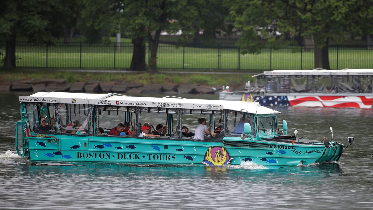 Duck boats, replicas of World War II-era amphibious vehicles, and a popular tourist attraction, make their way along the Charles River between Boston and Cambridge, Mass., Sunday, July 22, 2018. Five years after 17 people died when a tourist vessel known as a duck boat sank on a Missouri lake, the U.S. Coast Guard on Monday, Sept. 11, 2023 issued new rules for amphibious World War II vessels retrofitted for tourists. (AP Photo/Steven Senne, File)