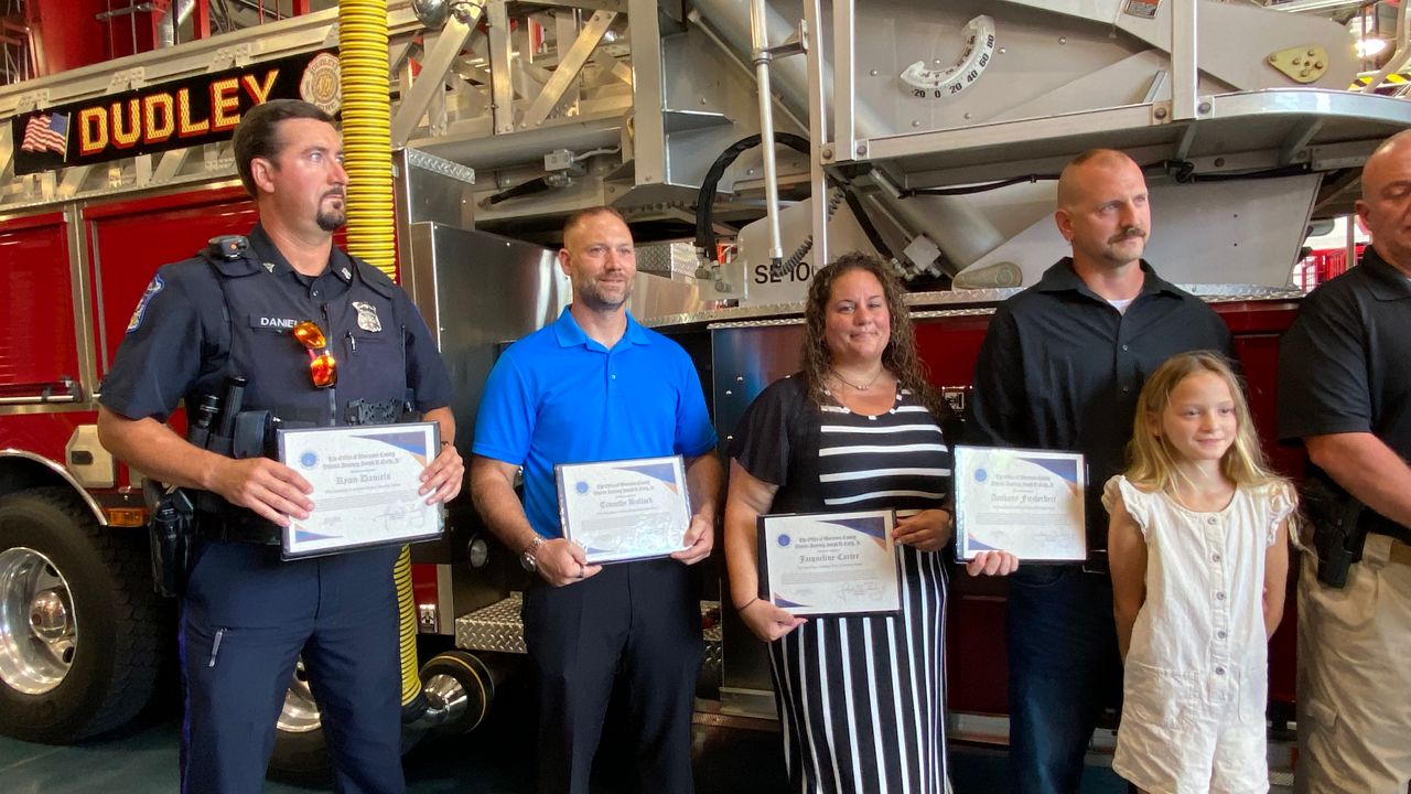 From left to right: Officer Ryan Daniels, Officer Timothy Bullock, Jacqueline Carter, and Anthony Fitzherbert.