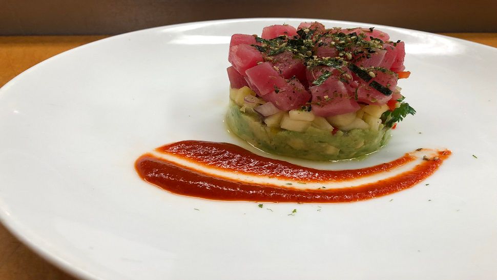 Duffy’s Sports Grill and Corporate Chef Eric Parker is introducing a new spring dish: Tuna Poke Stack. (Melissa Eichman, staff)