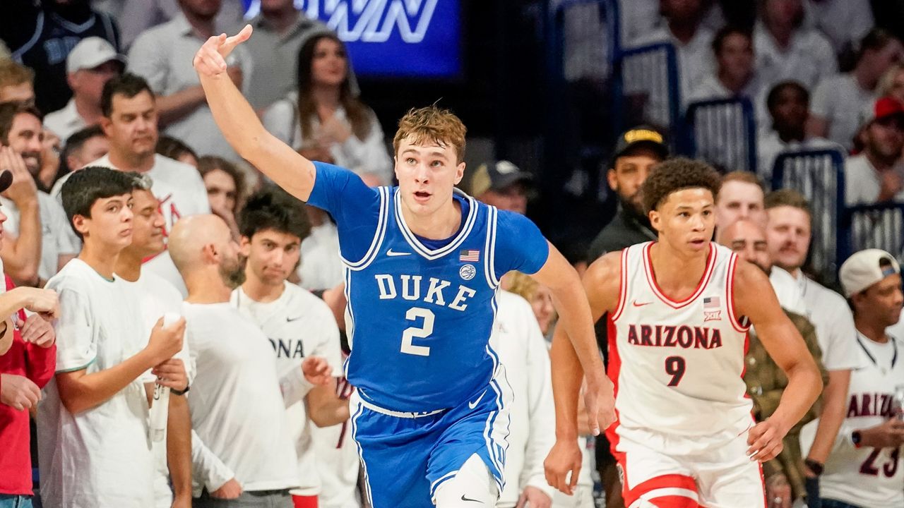 Duke guard Cooper Flagg (2) gestures after hitting a 3-point shot against Arizona during the second half of an NCAA college basketball game Friday, Nov. 22, 2024, in Tucson, Ariz. (AP Photo/Darryl Webb)