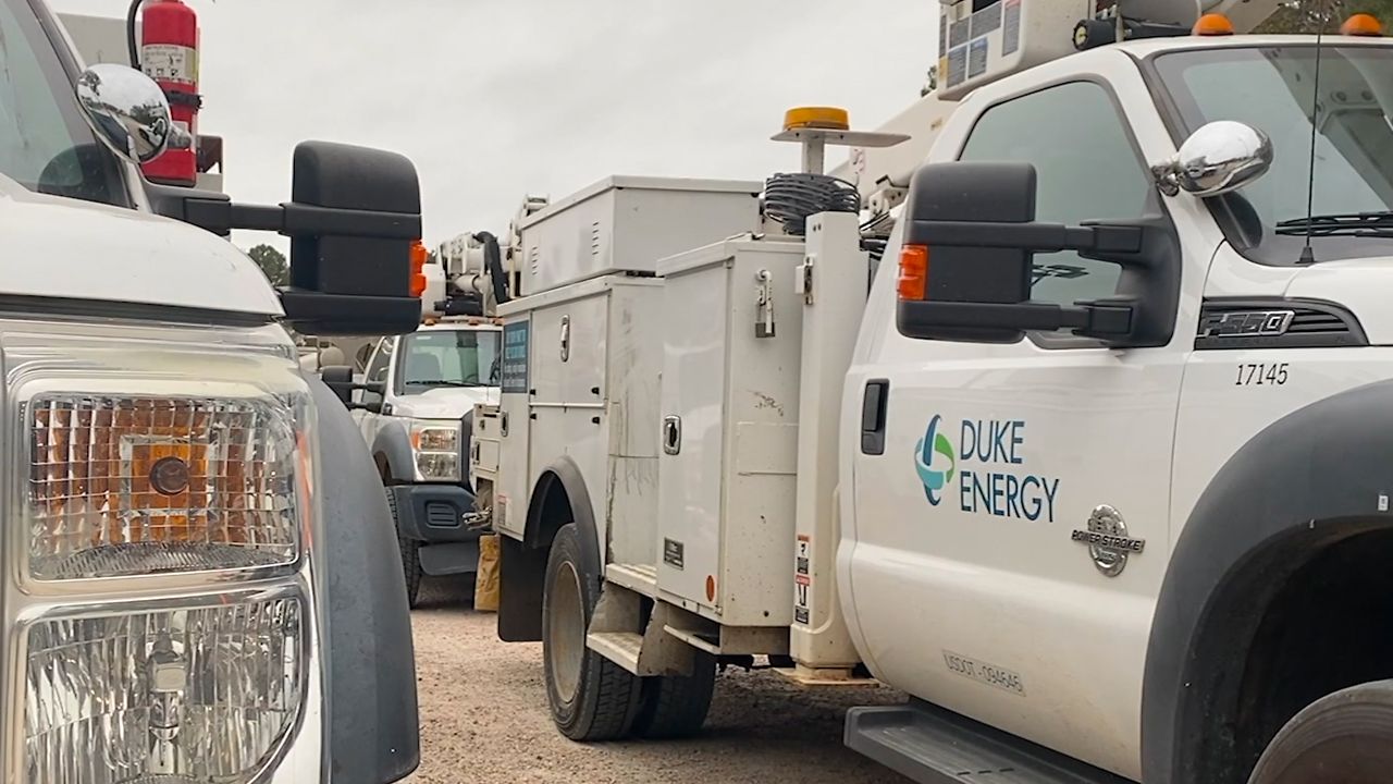 An assembly of Duke Energy service vehicles. (Spectrum News)