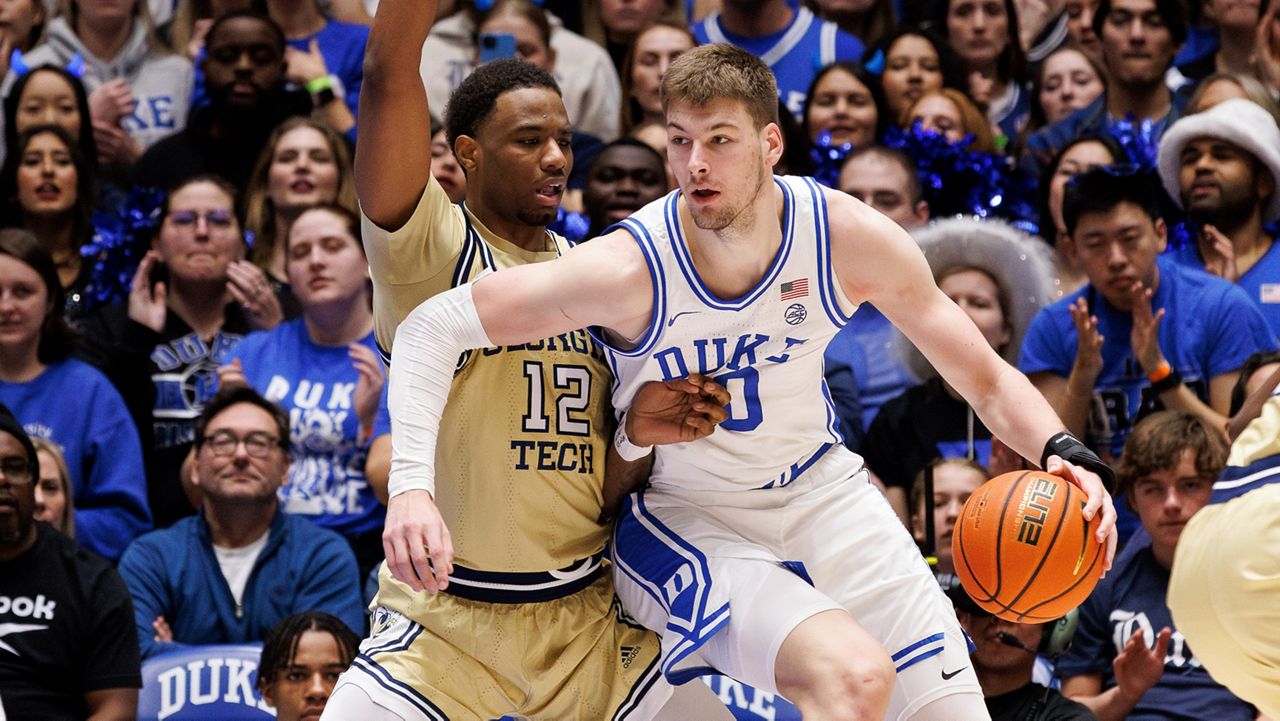 Duke's Kyle Filipowski, right, works against Georgia Tech's Tyzhaun Claude (12) in the post during the first half of an NCAA college basketball game in Durham, N.C., on Saturday, Jan. 13, 2024. (AP Photo/Ben McKeown)