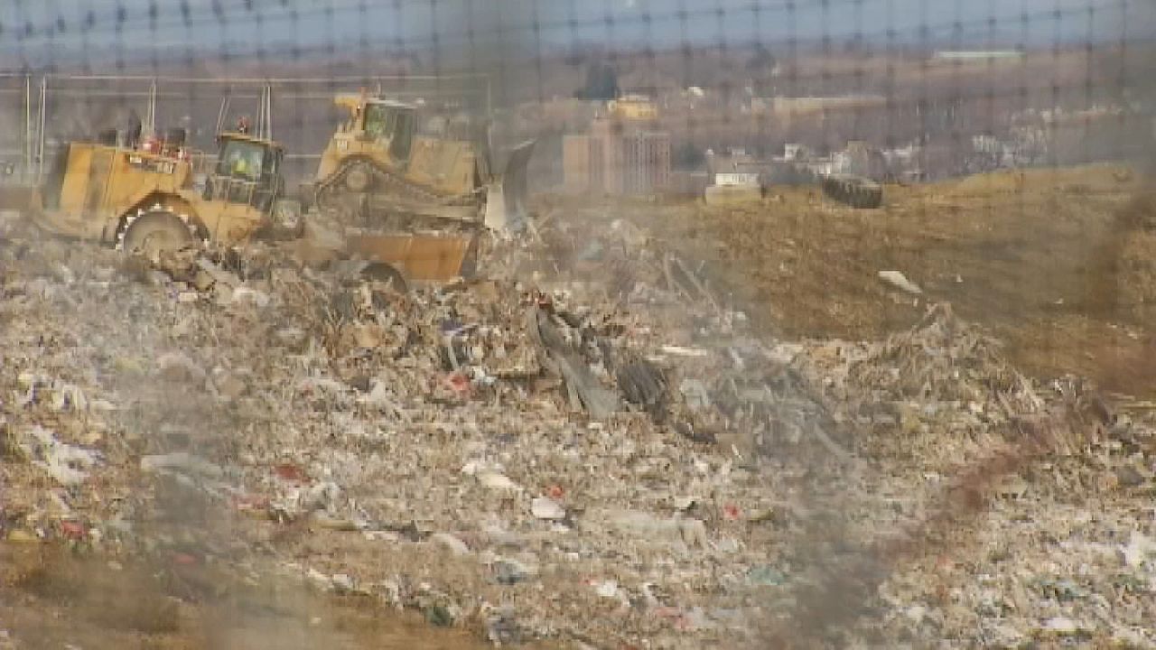 trash being covered at dunn landfill