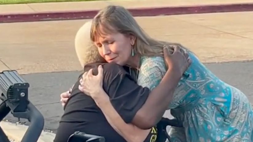 Kira Dunn embraces Christopher Dunn's mother moments after they learned the wrongfully convicted man would not be released from prison yet. (Spectrum News/Gregg Palermo)