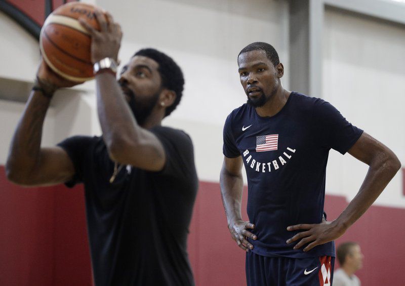 Kevin Durant, right, watches Kyrie Irving during a training camp for USA Basketball, Thursday, July 26, 2018, in Las Vegas. (AP Photo/John Locher)