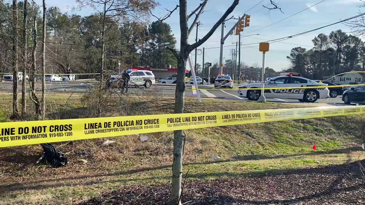 Durham police close part of Riddle Road as they investigate a shooting that left one boy dead and another wounded Wednesday afternoon in Durham. (Spectrum News 1/Patrick Thomas)