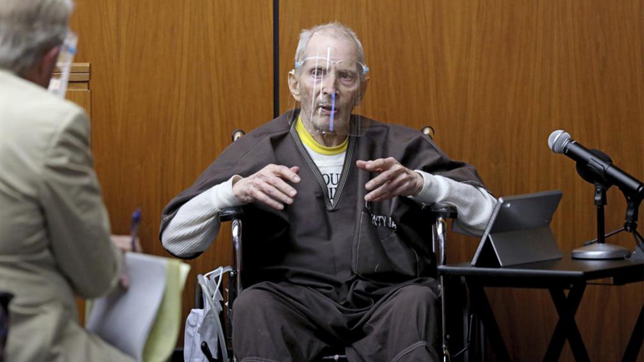 New York real estate scion Robert Durst, 78, answers questions from defense attorney Dick DeGuerin, left, while testifying in his murder trial at the Inglewood Courthouse on Monday, Aug. 9, 2021, in Inglewood, Calif. (Gary Coronado / Los Angeles Times via AP, Pool)