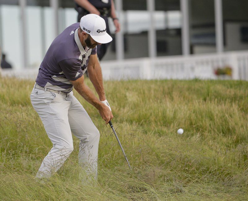 Dustin Johnson hits out of the rough on the 15th hole during the third round of the U.S. Open Golf Championship, Saturday, June 16, 2018, in Southampton, N.Y. (AP Photo/Seth Wenig)
