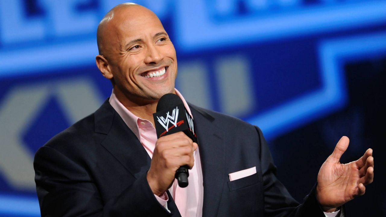 Actor and former WWE Superstar Dwayne "The Rock" Johnson participates in a news conference on Mar. 30, 2011 in New York. (AP Photo/Evan Agostini)