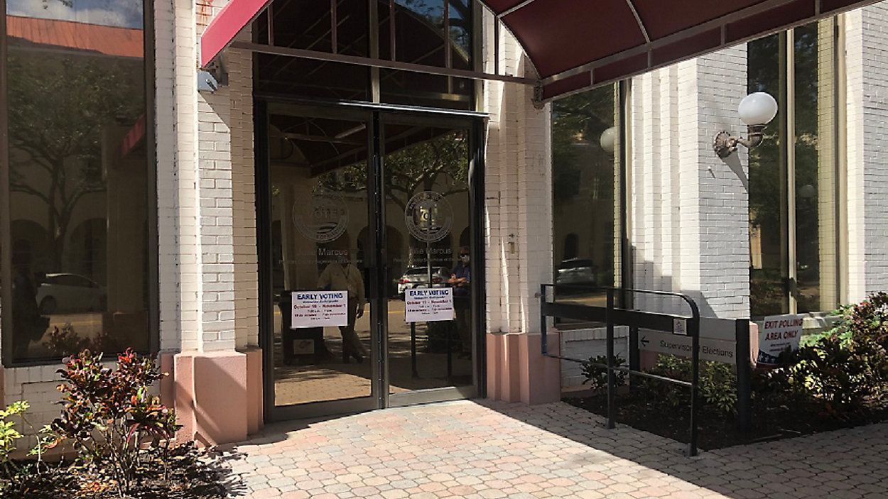 The scenario unfolded at an early voting location at 501 First Avenue North, where two armed men briefly stood outside the building. (Mitch Perry, Spectrum News staff)