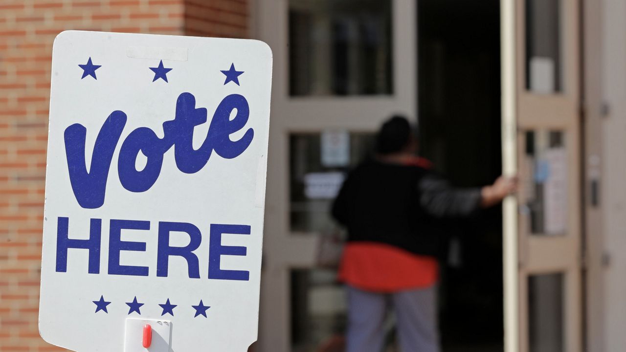 A sign appears outside of a voting location in this file image. (Spectrum News)