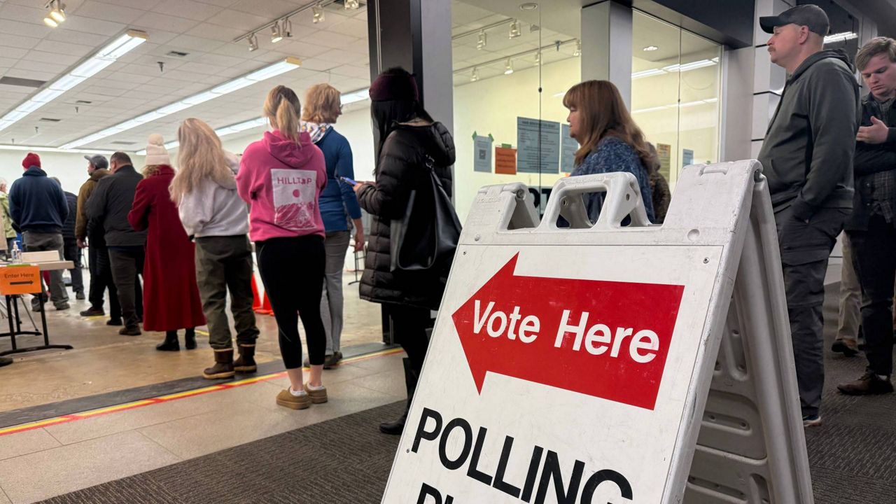 Economy, immigration, democracy among issues early voters say is driving them to the polls