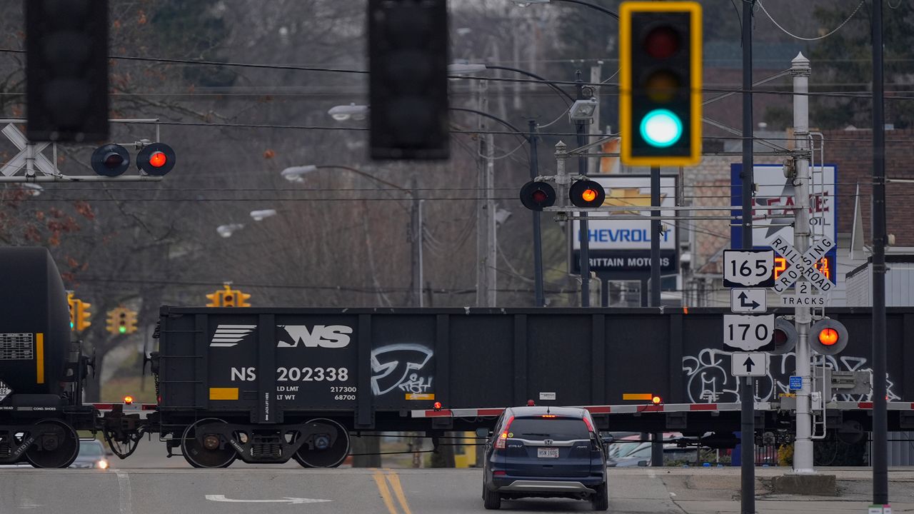 A Norfolk Southern train crosses Market Street in East Palestine, Ohio, on Tuesday, Jan. 30, 2024.