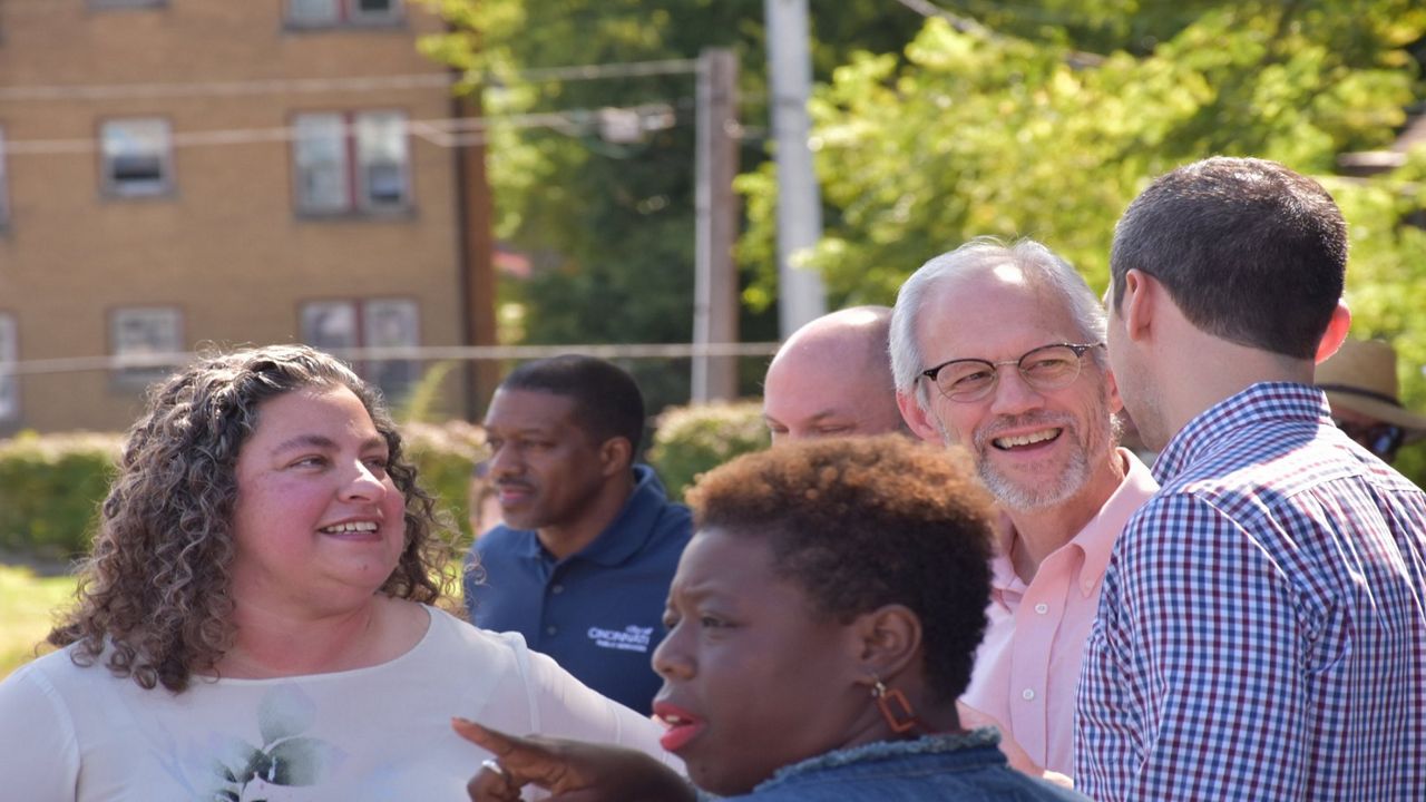Rachel Hastings (left) stands with Price Hill Residents during a Price Hill Will event on Warsaw Avenue (Casey Weldon | Spectrum News 1)