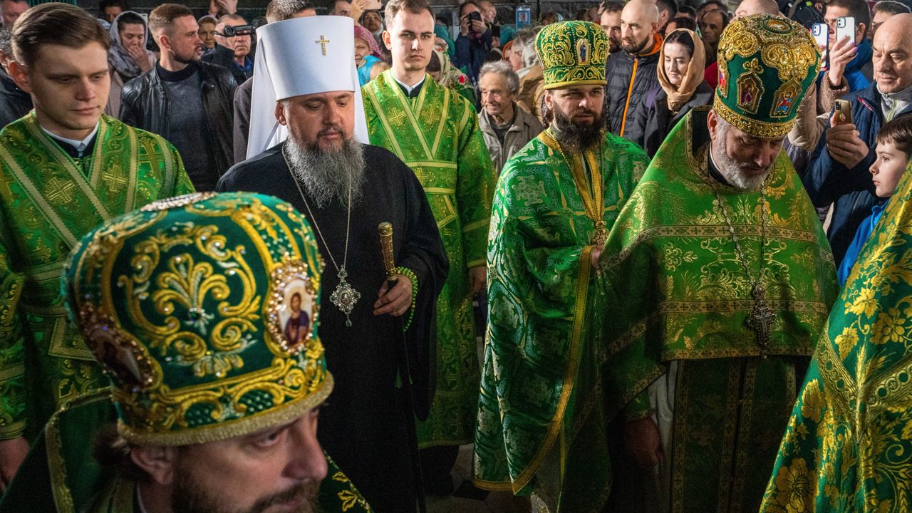 Metropolitan Epiphanius, head of the Orthodox Church of Ukraine, center, conducts the Palm Sunday service at Kiev-Pechersk Lavra monastery, Ukraine's most revered Orthodox site in Kyiv, Ukraine, Sunday, April 9, 2023. (AP Photo/Adam Pemble)