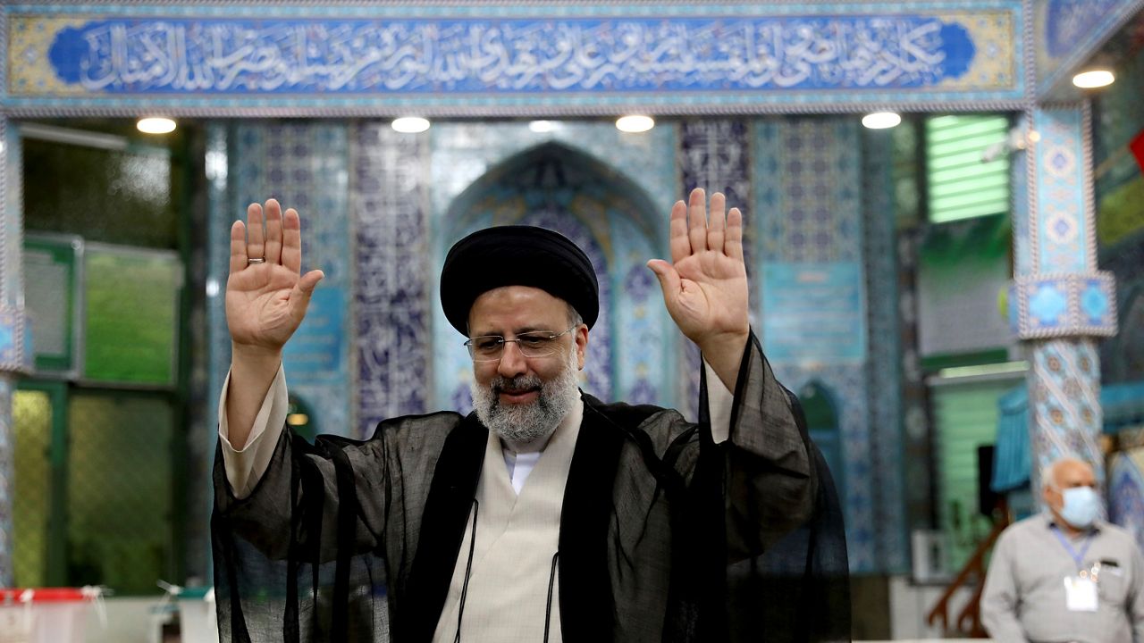 Ebrahim Raisi casts his vote at a polling station in Tehran.  (AP Photo/Ebrahim Noroozi)