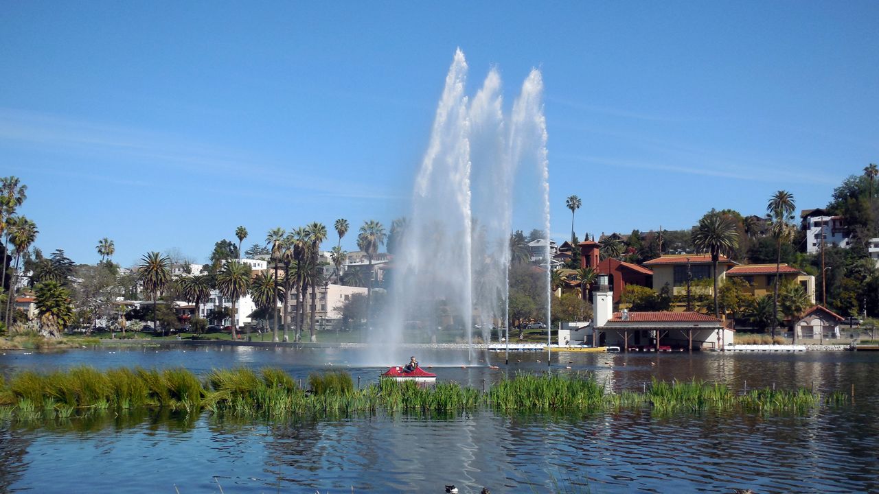 This March 12, 2015 photo shows Echo Park Lake, fountain and boathouse just north of downtown Los Angeles. (AP Photo/Reed Saxon)