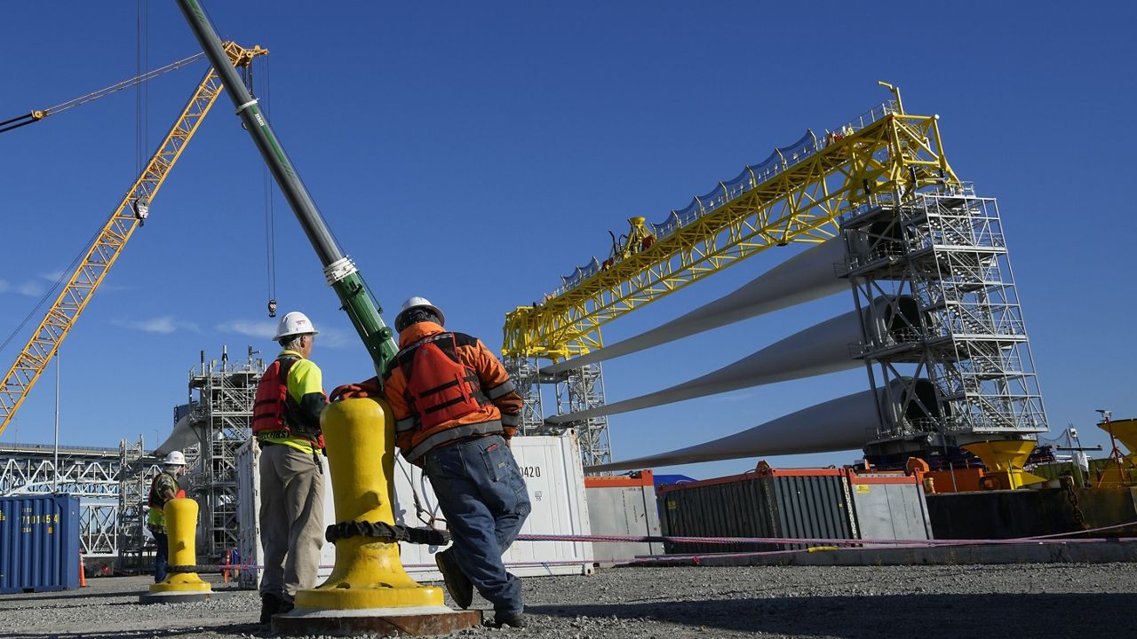 A generator and its blades are prepared to head to the open ocean for the South Fork Wind farm from State Pier in New London, Conn., Dec. 4, 2023. (AP Photo/Seth Wenig, File)