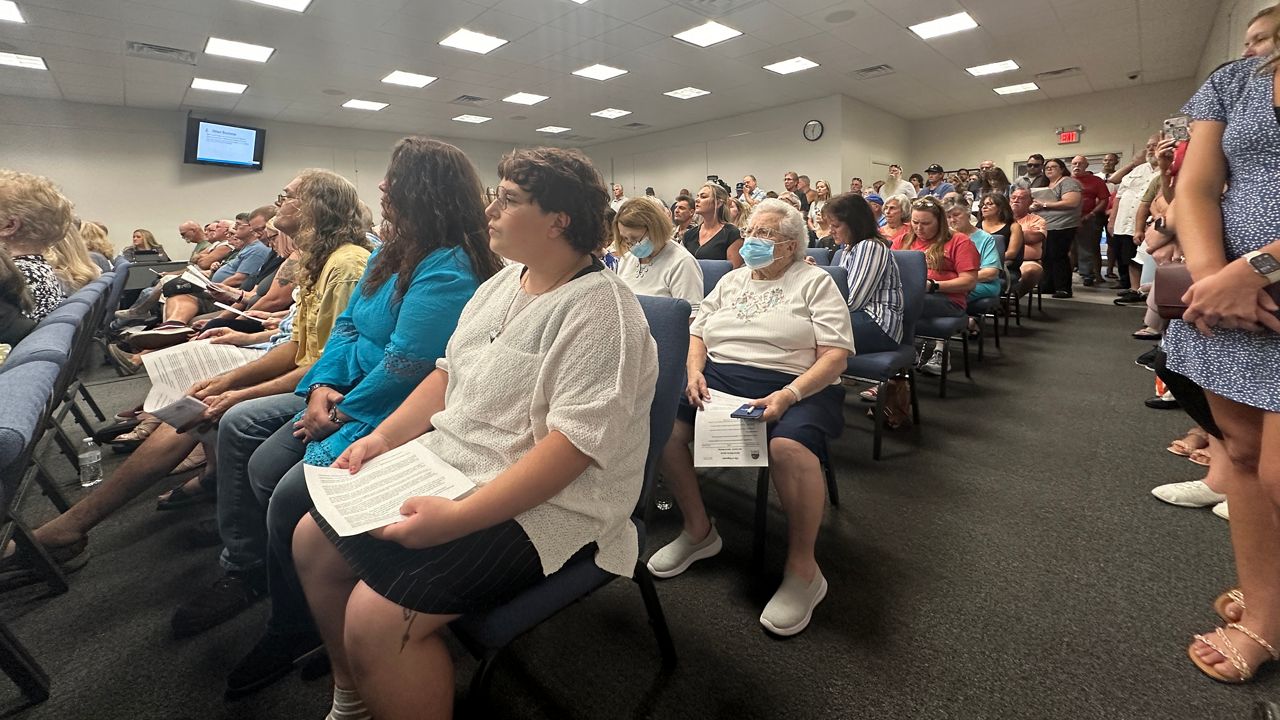 Edgewater residents listen during a special meeting Friday where the city council discussed the city’s multiple flooding concerns following a storm that left various neighborhoods underwater. (Spectrum News/Sasha Teman)