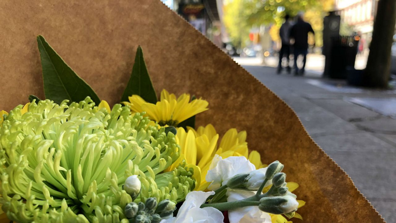 Bool's Flower Shop giving away 2 free bouquets to people in Downtown Ithaca.