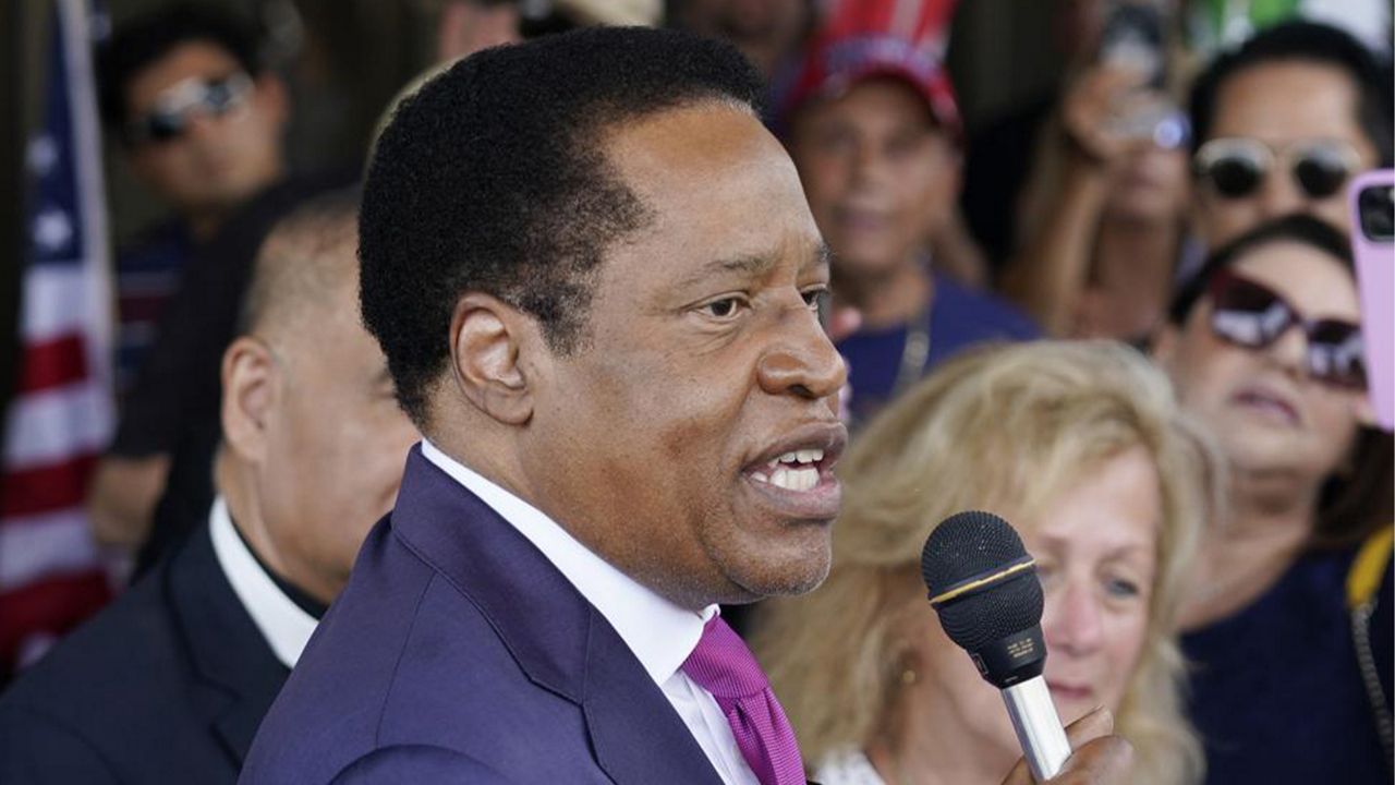 In this July 13, 2021, file photo, gubernatorial candidate and radio talk show host Larry Elder speaks to supporters during a campaign stop in Norwalk, Calif. (AP Photo/Marcio Jose Sanchez, File
