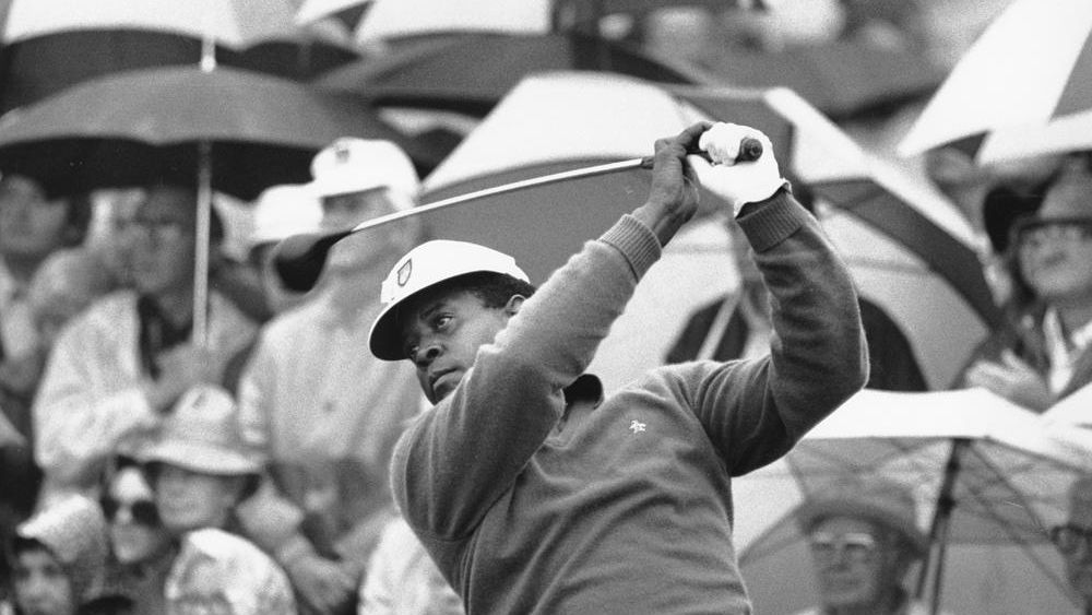 FILE - Lee Elder watches the flight of his ball as he tees off in the first round of play at the Masters in Augusta, Ga., in this April 10, 1975, file photo.  (AP Photo/File)