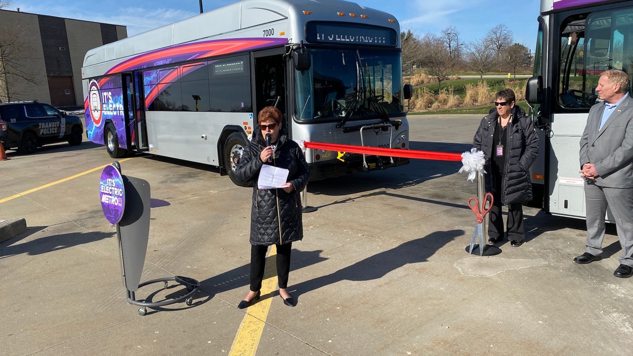 Summit County Executive Ilene Shapiro (left), METRO CEO Dawn Distler and Cuyahoga Falls Mayor Don Walters at a ribbon cutting for the county's first electric buses. (Jennifer Conn/Spectrum News1)