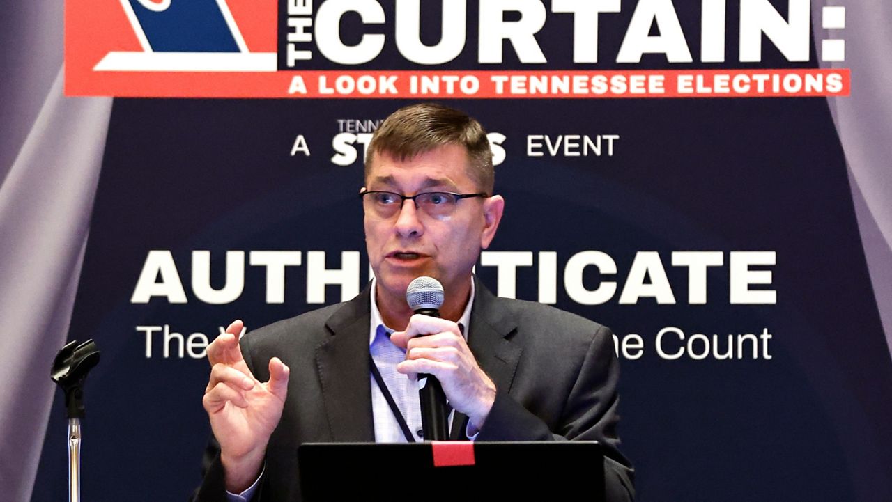Clay Parikn talks about variables in security during an Election Conspiracy Forum Saturday, March 11, 2023, in Franklin, Tenn. (AP Photo/Wade Payne)