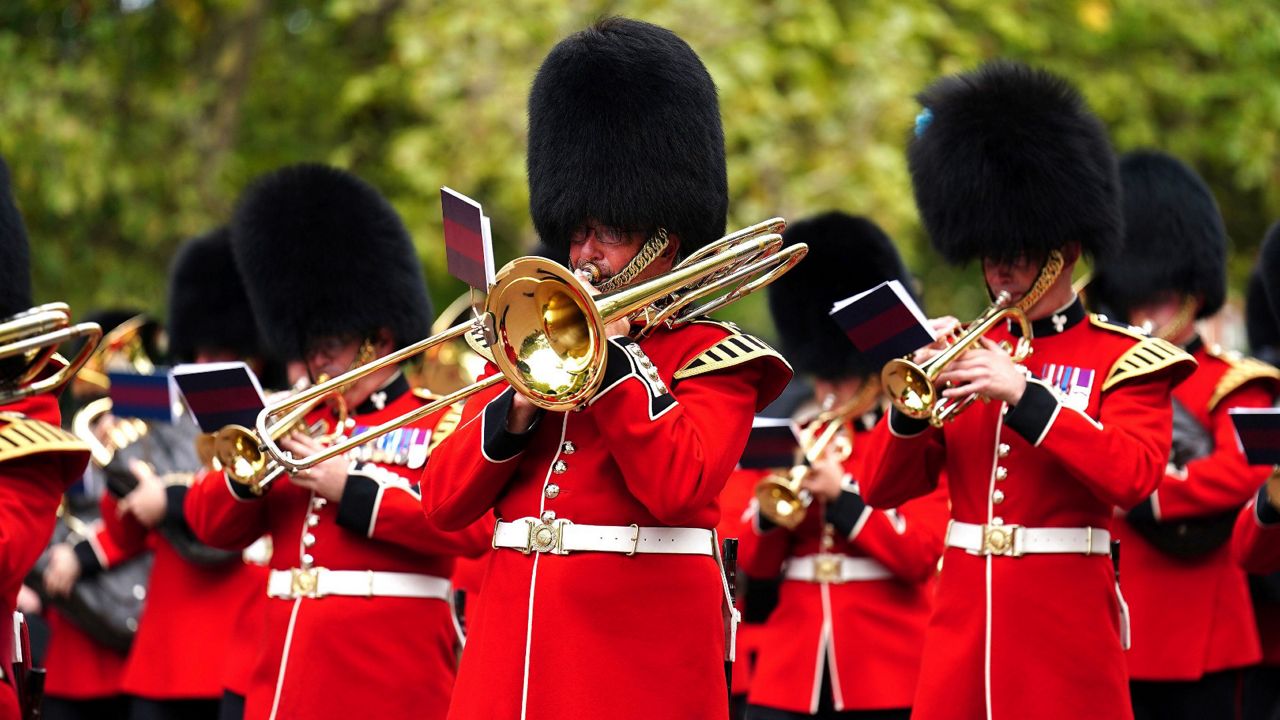 Members of the military band play as they march in the ceremonial procession of Queen Elizabeth II, following her State Funeral at Westminster Abbey. (Mike Egerton/Pool Photo via AP)