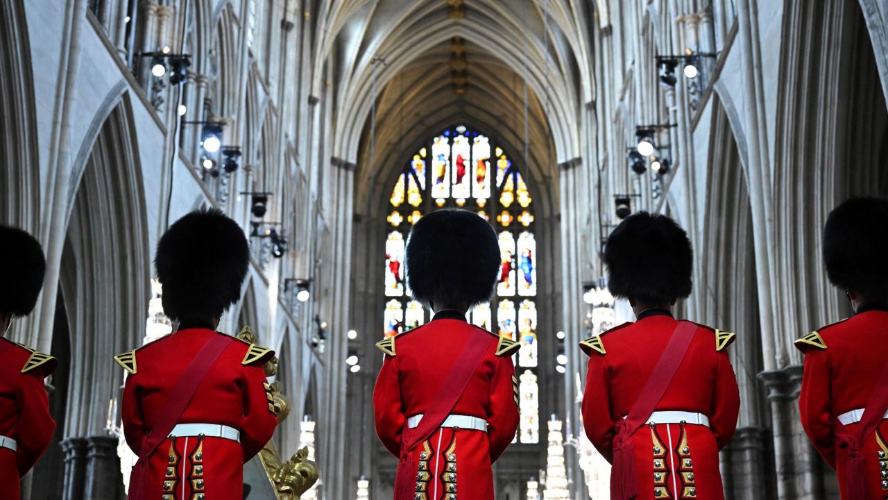 The fanfare team of the household division bands wait for arrivals at the funeral service of Queen Elizabeth II at Westminster Abbey. (Ben Stansall/Pool via AP)