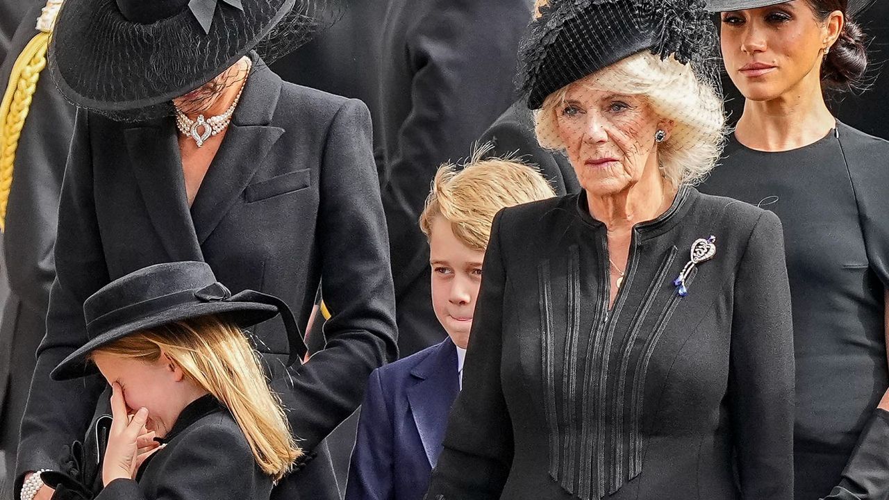 Princess Charlotte, left, cries as members of the royal family follow Queen Elizabeth's coffin after her funeral at Westminster Abbey. (AP Photo/Martin Meissner, Pool)